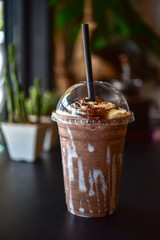 Chocolate smoothie (milkshake) with jar in cafe