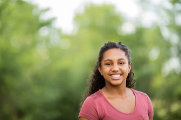 Young happy teen girl laughing and smiling.