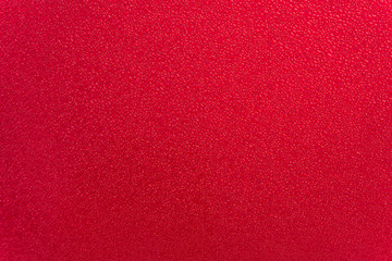 Drops of water on red Background.Macro photo, drop, shadow plastic base.