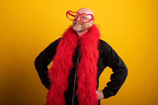 Funny Man With Red Glasses And Feather Boa