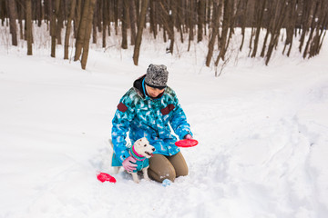 Fototapeta na wymiar Middle aged woman outdoors with cute dog - Jack Russell Terrier in winter season