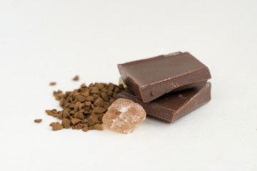 Chunk of chocolate, lump of brown sugar, instant coffee