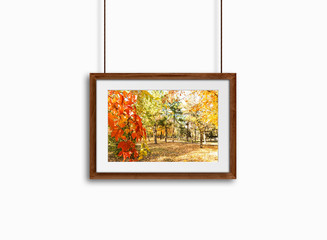  Frame mock up with colorful autumn motif picture, hanging on cords, 3d illustration