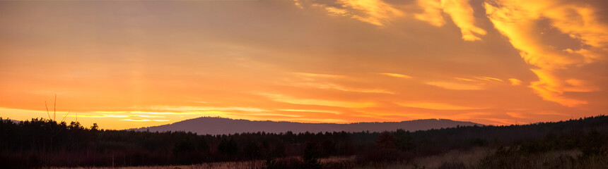 Panormatic view to sunset in mountain with forest, Czech landscape