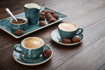 Two cup of coffee and with chocolate cookies