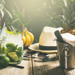 Summer vacation concept - against rustic tropical background