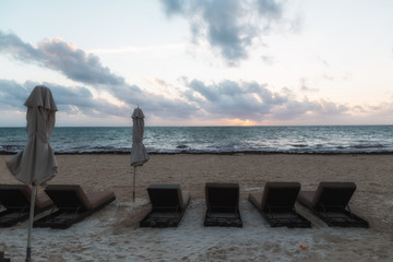 Beach chairs at sunrise
