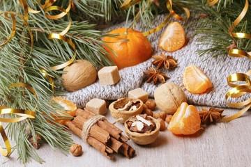 Still life composition formed with pine branches and New Year sweets