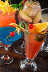 Multicolored cocktails at the bar close up shot