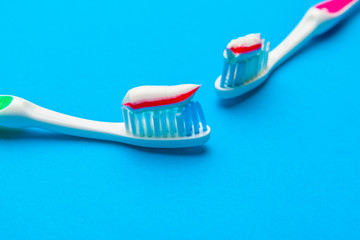 Flat lay composition with manual toothbrushes on color background, close up