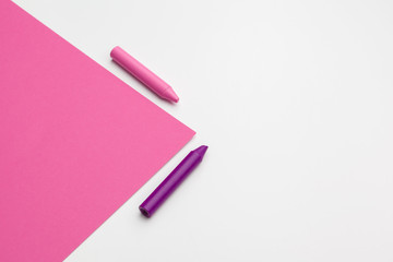 Pencil crayon on a bright pink background. Art concept