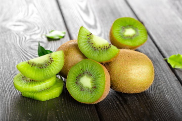 Juicy kiwi fruit on wooden table