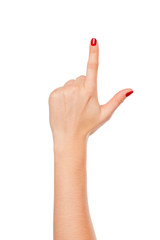 Woman's hand points a finger at something isolated on white background