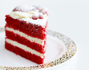 piece of red velvet cake on white background