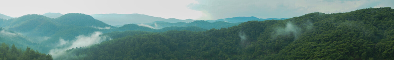 Fototapeta na wymiar Mountain panorama with a dramatic sky background