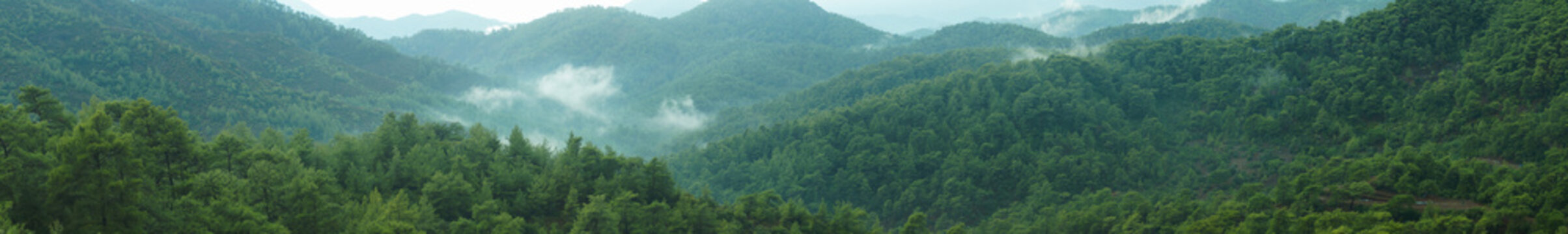 Mountain panorama with a dramatic sky background