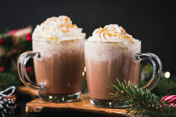 Christmas Hot Chocolate With Whipped Cream In Mug. Decorated With Golden Sugar Stars. Festive Christmas or Winter Holidays Drink, Comfort Food Concept