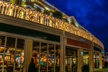 Restaurant in the eveningwith lights in Parndorf outlet in Vienna, Austria