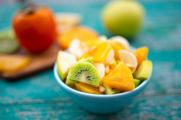 A healthy and delicious salad with various fruits.
