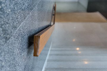 marble stairs with wooden handrail in building for step up or down safety - Interior