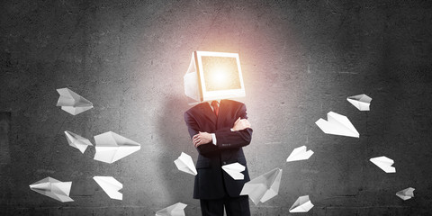 Businessman with monitor instead of head.