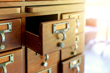 Old wooden vintage Medicine drawer cabinet. Catalog file cabinet. Data storage