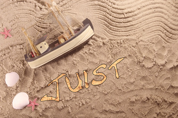 Textzug Juist mit Kutter und Muscheln © duesselmax