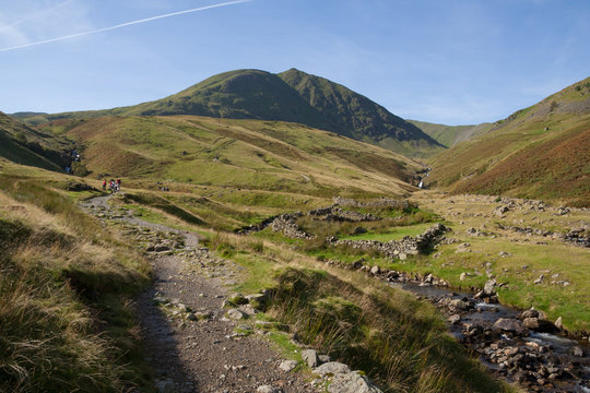 People walking up footpath to Helvellyn mountain near Glenridding, Lake District