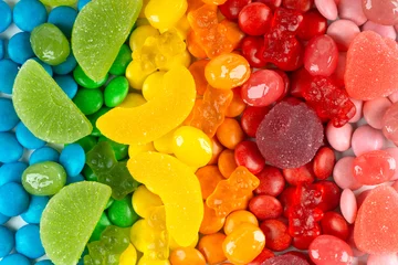 Poster Background of mixed colorful candies © seralex