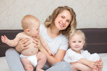mom playing with her two kids at home