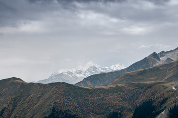 Fototapeta na wymiar Dark mountain landscape. Caucasian mountains in cloudy weather.