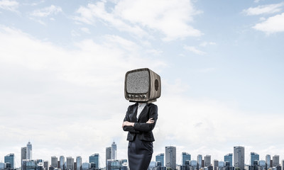 Business woman with old TV instead of head.