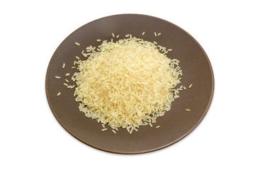 Uncooked parboiled rice on the brown dish