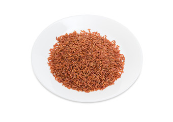 Uncooked red rice on the white dish
