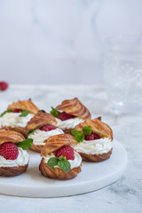 Raspberries Profiteroles with White Chocolate cream