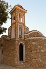 Fototapeta na wymiar Church of the Holy Prophet Elijah, in the village of Protaras, Cyprus, Europe. Summer, Sunny evening .