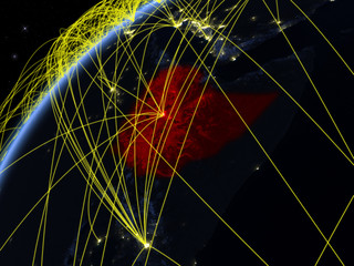 Ethiopia on model of planet Earth at night with international networks. Concept of digital communication and technology.
