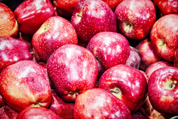 many fresh raw red apples as background