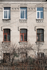 Fototapeta na wymiar White brick residential building facade