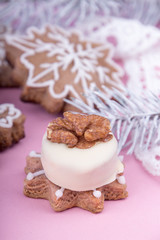 Christmass New Year decorations. Greeting card. White chocolate candy, gingerbread cookies. Tender pink color. Vintage style.