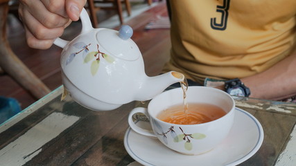 People are pouring tea