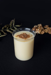 Traditional Turkish drink consumed frequently during winter months Boza or Bosa. Black background.