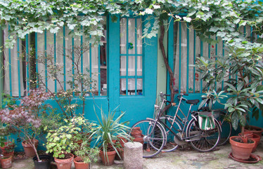 Fototapeta na wymiar France. A colourfull street with 2 bikes