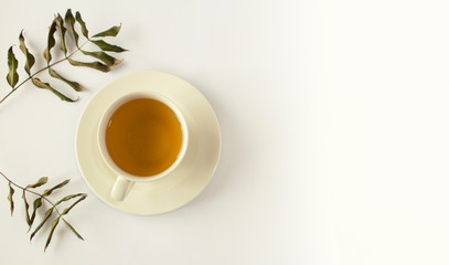 Herbal tea, view from above with headphone, leaves and book. Winter concept, Autumn concept.