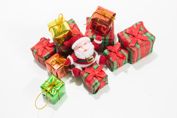 Santa claus doll with gift box isolated white background closeup.