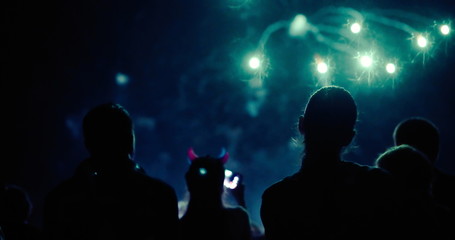 Crowd watching fireworks and celebrating new year eve