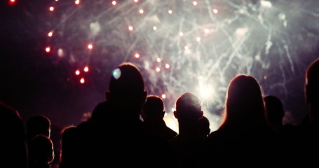 Crowd watching fireworks and celebrating new year eve