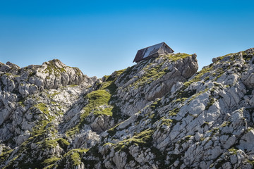 Old sheep barn on limestone rocks in the Julian Alps, Slovenia