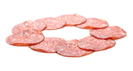 Salami sausage slices isolated on white background