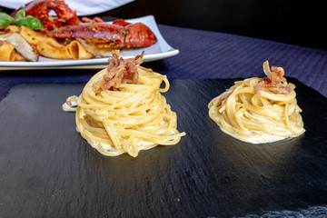 Italian Pasta With Lobster And Spaghetti Carbonara, Front View